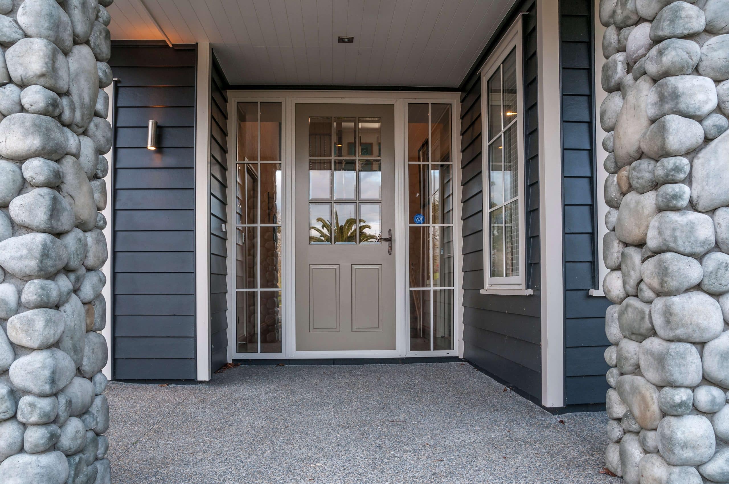 Why does having my timber door exposed to the elements void the manufacturer’s warranty?