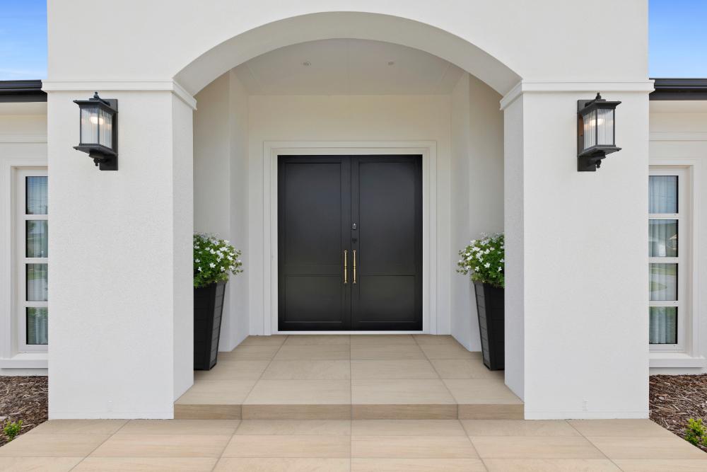 How do black powder coats perform on aluminium front doors?