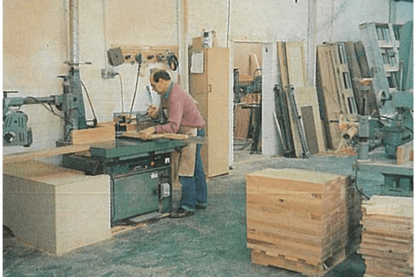Boards each have their own distinctive grain colouring and are stacked ready for machining